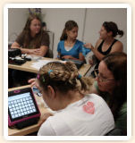 Young adults practice using their devices to converse